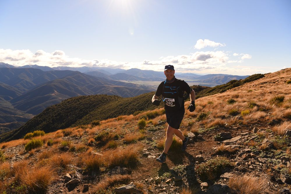 Chris van der Leer trail running along a ridge line near Mt Oxford, 2018