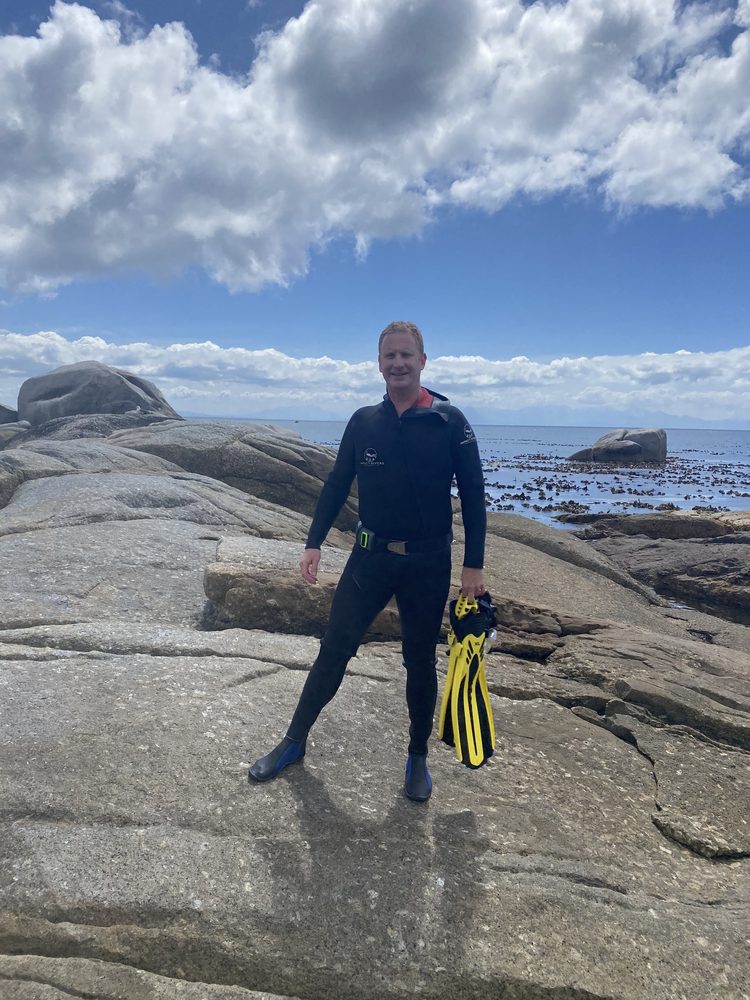 Chris van der Leer freediving gear on the rocks in South Africa, 2022